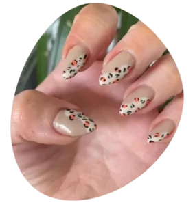 Nails with pattern on brown in colour